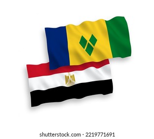 National vector fabric wave flags of Saint Vincent and the Grenadines and Egypt isolated on white background. 1 to 2 proportion.