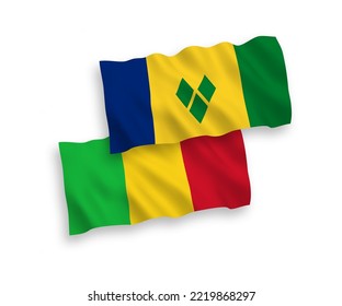 National vector fabric wave flags of Saint Vincent and the Grenadines and Mali isolated on white background. 1 to 2 proportion.