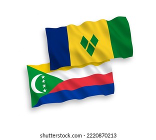 National vector fabric wave flags of Saint Vincent and the Grenadines and Union of the Comoros isolated on white background. 1 to 2 proportion.