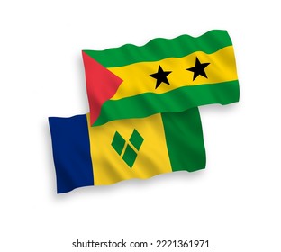 National vector fabric wave flags of Saint Vincent and the Grenadines and Saint Thomas and Prince isolated on white background. 1 to 2 proportion.