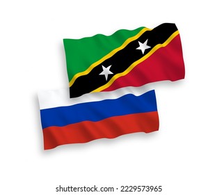 Banderas de olas de tela vectorial nacional de la Federación de Saint Christopher y Nevis y Rusia aisladas en fondo blanco. de 1 a 2.