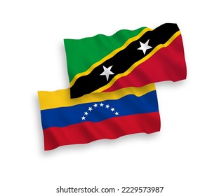 National vector fabric wave flags of Venezuela and Federation of Saint Christopher and Nevis isolated on white background. 1 to 2 proportion.