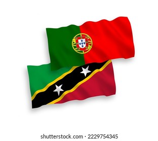 National vector fabric wave flags of Portugal and Federation of Saint Christopher and Nevis isolated on white background. 1 to 2 proportion.