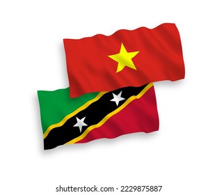National vector fabric wave flags of Federation of Saint Christopher and Nevis and Vietnam isolated on white background. 1 to 2 proportion.