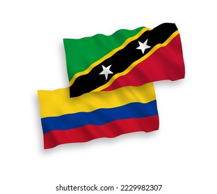 National vector fabric wave flags of Federation of Saint Christopher and Nevis and Colombia isolated on white background. 1 to 2 proportion.