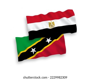Banderas de ondulación de tela vectorial nacional de la Federación de Saint Christopher y Nevis y Egipto aisladas en fondo blanco. de 1 a 2.