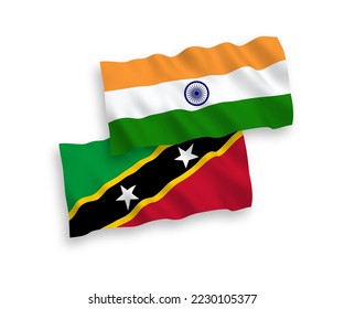 National vector fabric wave flags of India and Federation of Saint Christopher and Nevis isolated on white background. 1 to 2 proportion.