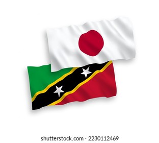 Banderas de ondulación de tela vectorial nacional de Japón y Federación de Saint Christopher y Nevis aisladas en fondo blanco. de 1 a 2.