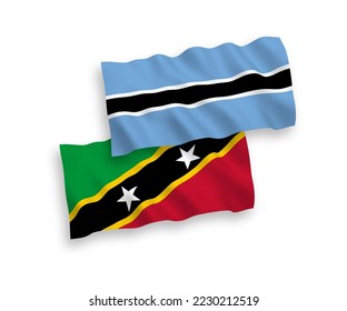 Nationale Vektor-Wellen-Flaggen der Föderation von Saint Christopher und Nevis und Botswana einzeln auf weißem Hintergrund. 1 bis 2 %.