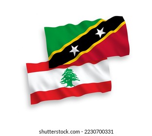 Banderas de ondulación de tela vectorial nacional de la Federación de Saint Christopher y Nevis y el Líbano aisladas en fondo blanco. de 1 a 2.