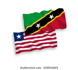 National vector fabric wave flags of Federation of Saint Christopher and Nevis and Liberia isolated on white background. 1 to 2 proportion.