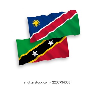 National vector fabric wave flags of Federation of Saint Christopher and Nevis and Republic of Namibia isolated on white background. 1 to 2 proportion.