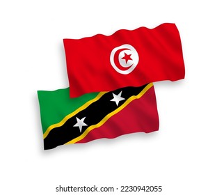 Banderas de olas de tela vectorial nacional de la Federación de Saint Christopher y Nevis y la República de Túnez aisladas en fondo blanco. de 1 a 2.