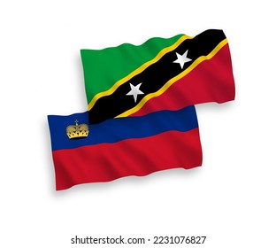 National vector fabric wave flags of Federation of Saint Christopher and Nevis and Liechtenstein isolated on white background. 1 to 2 proportion.