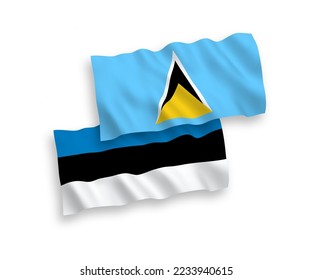 National vector fabric wave flags of Estonia and Saint Lucia isolated on white background. 1 to 2 proportion.