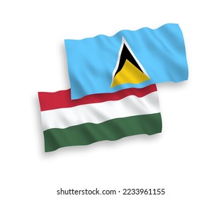 National vector fabric wave flags of Saint Lucia and Hungary isolated on white background. 1 to 2 proportion.