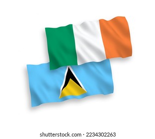 National vector fabric wave flags of Ireland and Saint Lucia isolated on white background. 1 to 2 proportion.