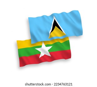 Banderas de olas de tela vectorial nacional de Santa Lucía y Myanmar aisladas de fondo blanco. de 1 a 2.