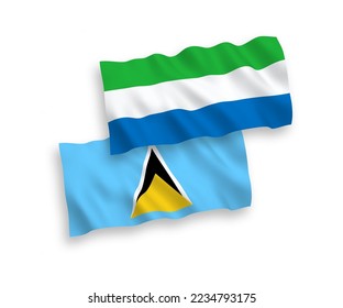 National vector fabric wave flags of Saint Lucia and Sierra Leone isolated on white background. 1 to 2 proportion.
