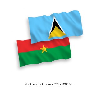 National vector fabric wave flags of Saint Lucia and Burkina Faso isolated on white background. 1 to 2 proportion.