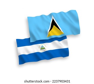 National vector fabric wave flags of Saint Lucia and Nicaragua isolated on white background. 1 to 2 proportion.