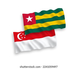 National vector fabric wave flags of Togolese Republic and Singapore isolated on white background. 1 to 2 proportion.