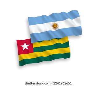 National vector fabric wave flags of Togolese Republic and Argentina isolated on white background. 1 to 2 proportion.