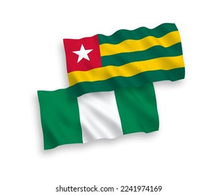National vector fabric wave flags of Togolese Republic and Nigeria isolated on white background. 1 to 2 proportion.