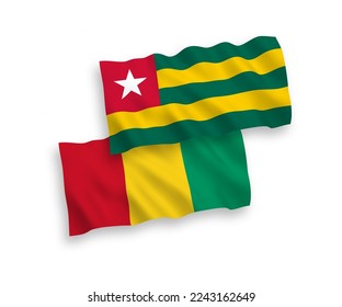 National vector fabric wave flags of Togolese Republic and Guinea isolated on white background. 1 to 2 proportion.