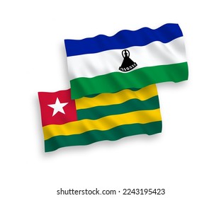 National vector fabric wave flags of Togolese Republic and Lesotho isolated on white background. 1 to 2 proportion.