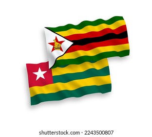 National vector fabric wave flags of Togolese Republic and Zimbabwe isolated on white background. 1 to 2 proportion.