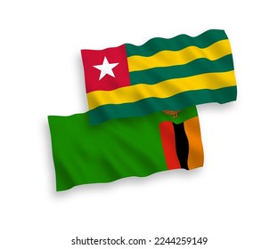 National vector fabric wave flags of Togolese Republic and Republic of Zambia isolated on white background. 1 to 2 proportion.