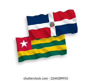 National vector fabric wave flags of Togolese Republic and Dominican Republic isolated on white background. 1 to 2 proportion.