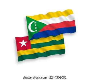 National vector fabric wave flags of Togolese Republic and Union of the Comoros isolated on white background. 1 to 2 proportion.