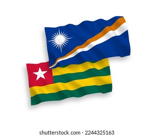 National vector fabric wave flags of Togolese Republic and Republic of the Marshall Islands isolated on white background. 1 to 2 proportion.
