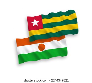 National vector fabric wave flags of Togolese Republic and Republic of the Niger isolated on white background. 1 to 2 proportion.