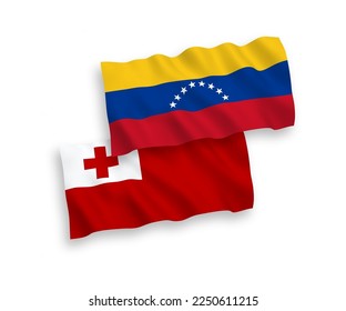 National vector fabric wave flags of Venezuela and Kingdom of Tonga isolated on white background. 1 to 2 proportion.