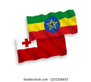 National vector fabric wave flags of Kingdom of Tonga and Ethiopia isolated on white background. 1 to 2 proportion.