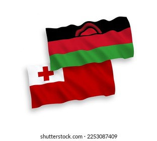 National vector fabric wave flags of Kingdom of Tonga and Malawi isolated on white background. 1 to 2 proportion.
