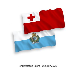 National vector fabric wave flags of Kingdom of Tonga and San Marino isolated on white background. 1 to 2 proportion.