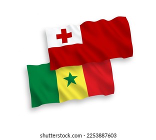 National vector fabric wave flags of Kingdom of Tonga and Republic of Senegal isolated on white background. 1 to 2 proportion.