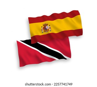 National vector fabric wave flags of Republic of Trinidad and Tobago and Spain isolated on white background. 1 to 2 proportion.