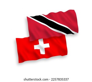 National vector fabric wave flags of Republic of Trinidad and Tobago and Switzerland isolated on white background. 1 to 2 proportion.