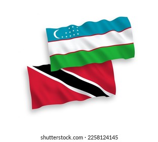 National vector fabric wave flags of Republic of Trinidad and Tobago and Uzbekistan isolated on white background. 1 to 2 proportion.