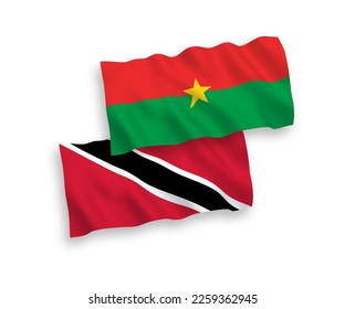 National vector fabric wave flags of Republic of Trinidad and Tobago and Burkina Faso isolated on white background. 1 to 2 proportion.