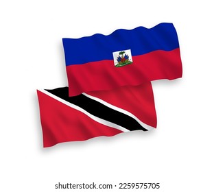 National vector fabric wave flags of Republic of Trinidad and Tobago and Republic of Haiti isolated on white background. 1 to 2 proportion.