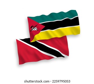 National vector fabric wave flags of Republic of Trinidad and Tobago and Republic of Mozambique isolated on white background. 1 to 2 proportion.