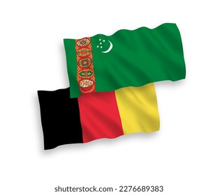 National vector fabric wave flags of Turkmenistan and Belgium isolated on white background. 1 to 2 proportion.