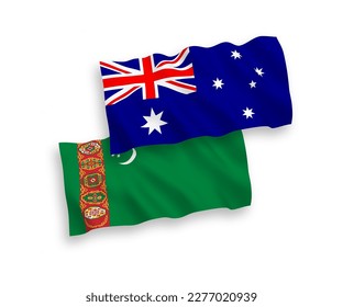National vector fabric wave flags of Australia and Turkmenistan isolated on white background. 1 to 2 proportion.
