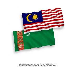 National vector fabric wave flags of Turkmenistan and Malaysia isolated on white background. 1 to 2 proportion.